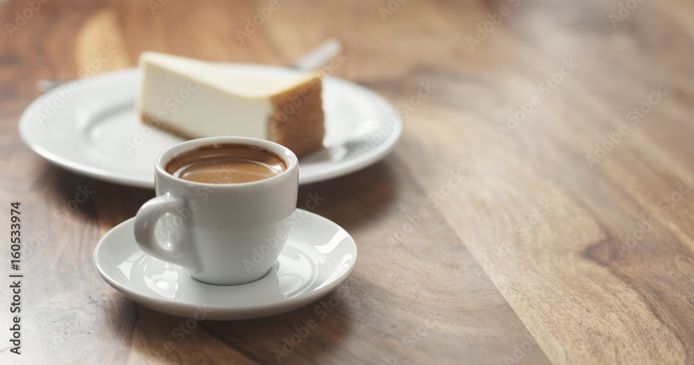 Obraz premium espresso and cheesecake on table