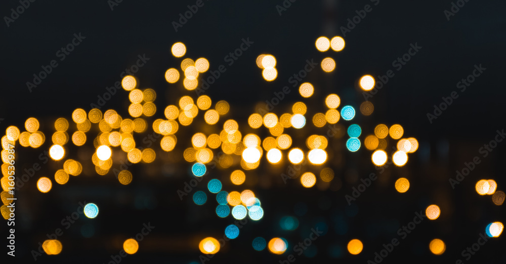Beautiful glowing city in the bokeh in the rain gorgeous background texture