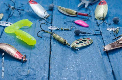Fishing lures for spinning. Front view. Tee, lure, soft bait, wobblers. Water drops.
