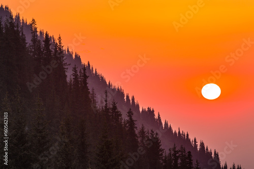 Sunset on the mountainside, orange sky