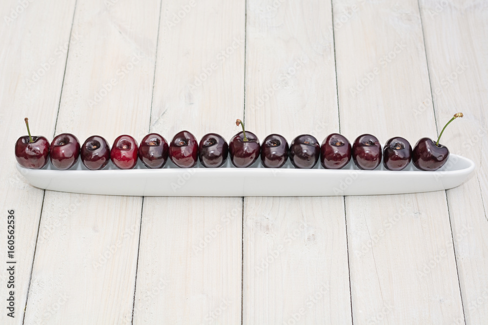 Olive boat filled with cherries Olive boat filled with cherries