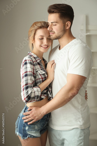 Happy young couple at home © Africa Studio