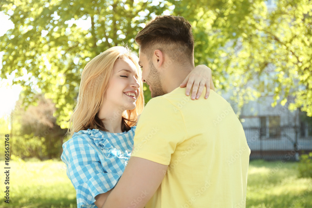 Happy young couple outdoors on spring day