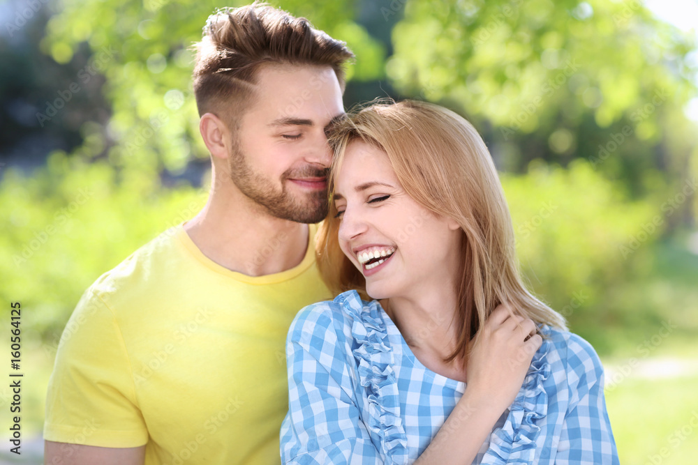 Fototapeta premium Happy young couple in park on spring day