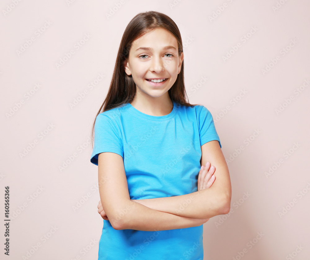 Fototapeta premium Cute pretty girl on color background