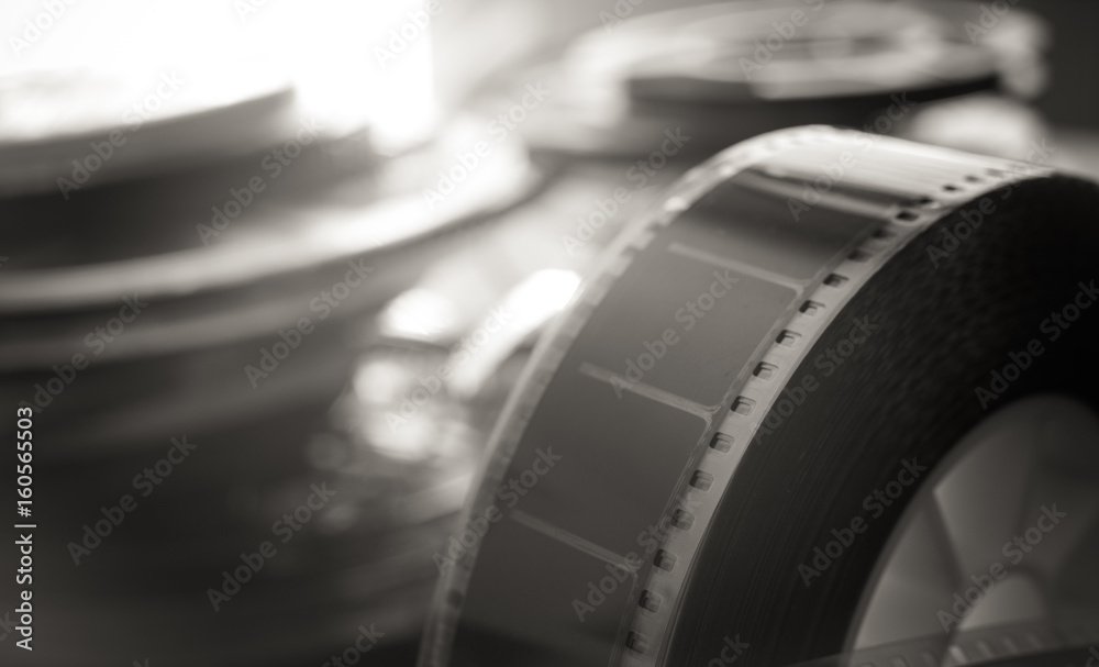 Fototapeta premium Past time movie symbol, 35 mm film reel evocative objects