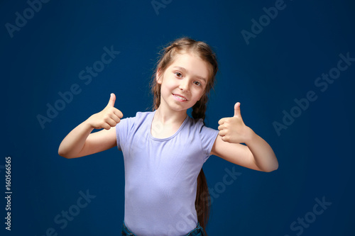 Cute funny girl on color background