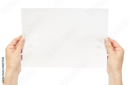 Beautiful female hand holding white paper. Isolated on white background