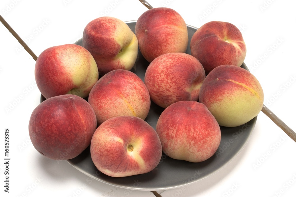 Fresh white peaches on a white wooden table. Fresh white peaches on a white wooden table.