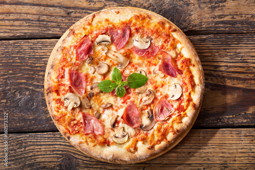 pizza with ham, salami and mushrooms