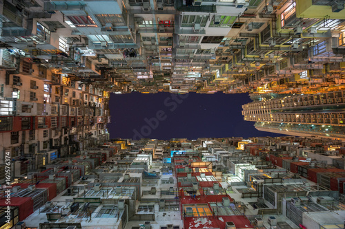 Low angle view of crowded residential towers in an old community in Quarry Bay, Hong Kong. Scenery of overcrowded narrow apartments, a phenomenon of high housing density & housing blues in Hongkong.