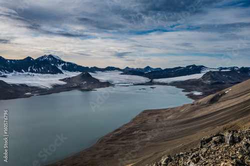 Glacier and mountain range under the clouds