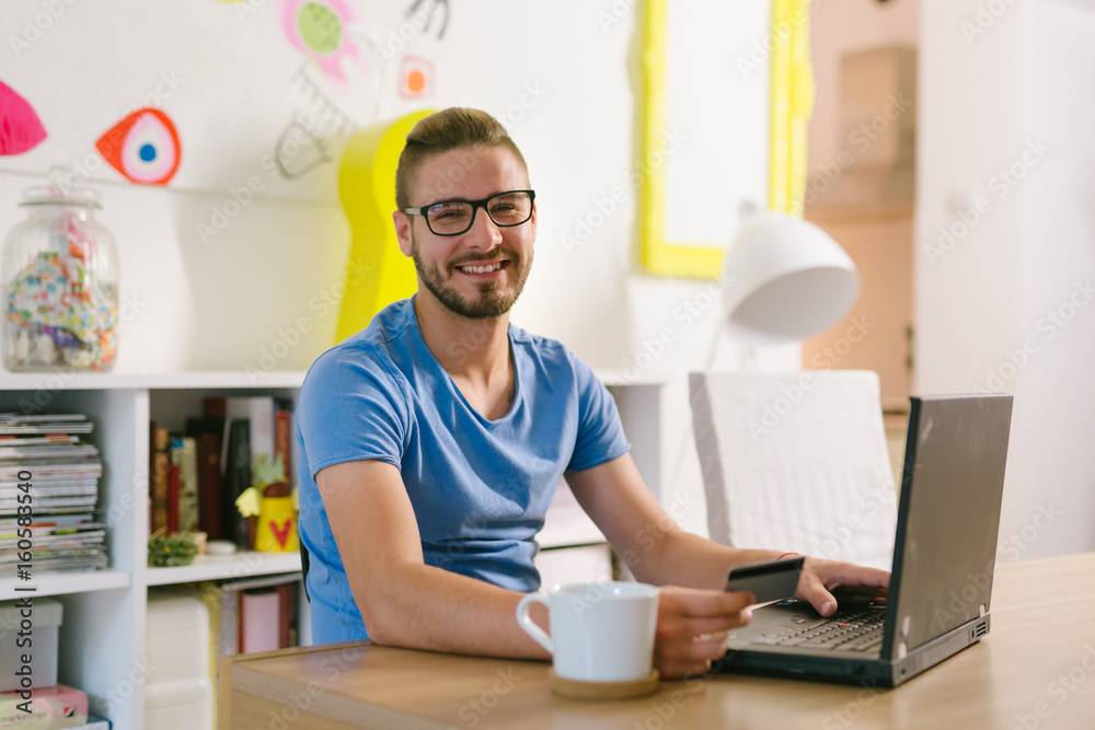 online shopping. Man using his credit card for online shopping online shopping. Man using his credit card for online shopping
