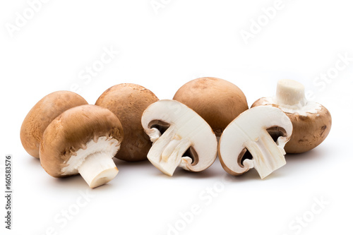 Fresh champignon mushrooms isolated on white.