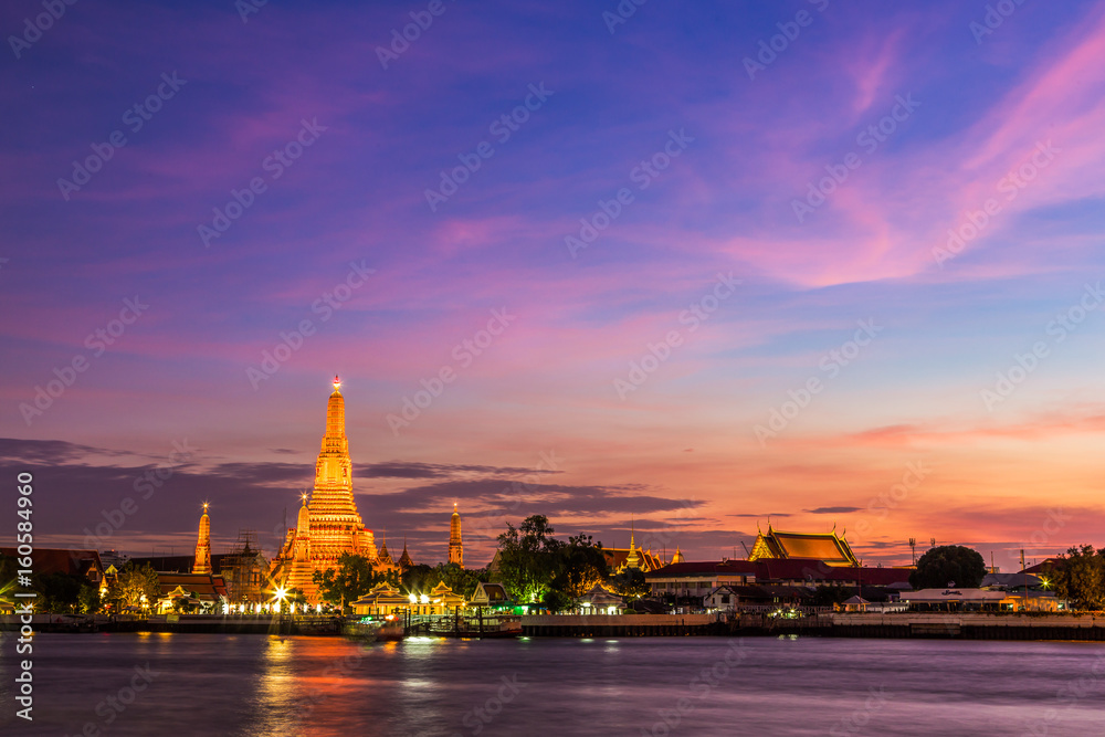 Light up Wat Arun temple at night in Bangkok, Thailand.