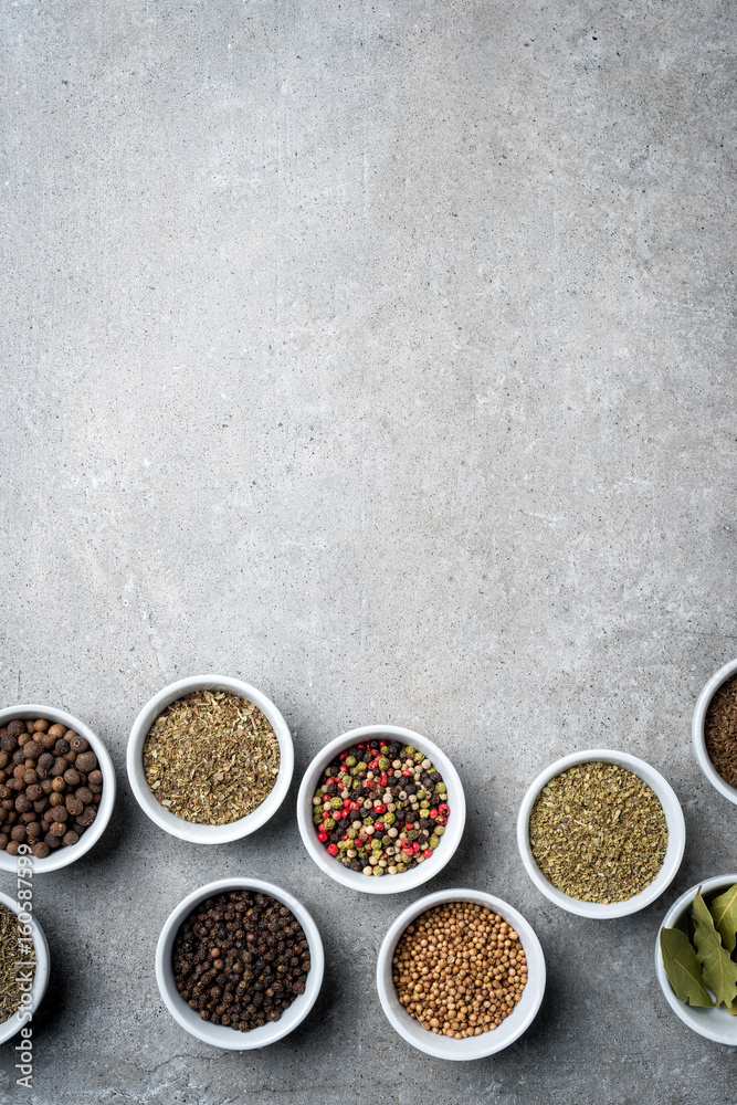 Herbs and spices in white bowls. Top view Herbs and spices in white bowls. Top view