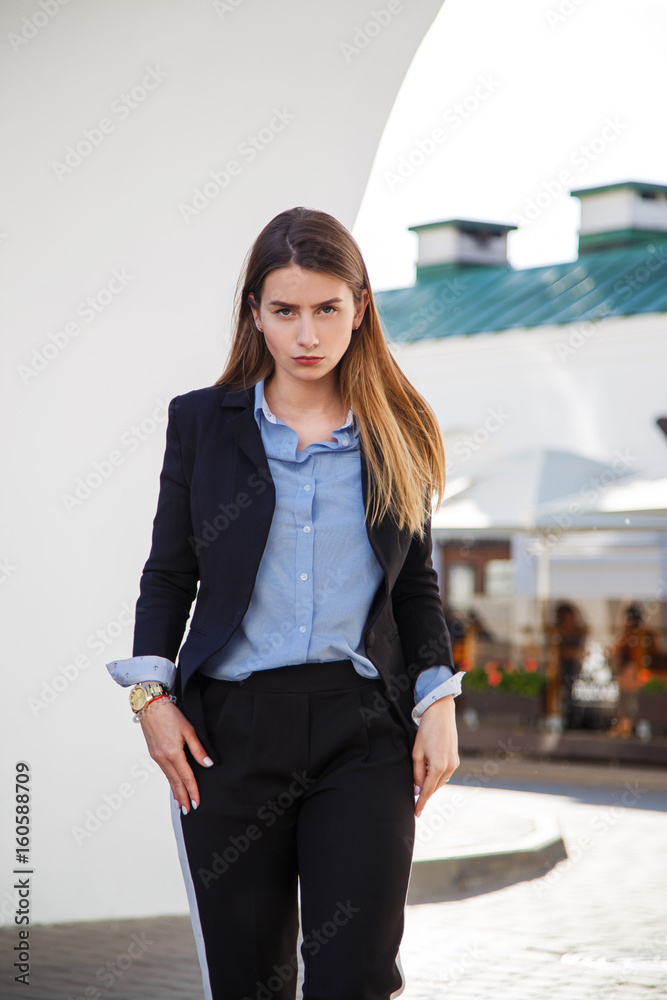 © vladdeep - Beautiful woman portrait with long healthy hair. Fashionable women's look with black jacket and blue blouse. Fashion concept. © vladdeep - Beautiful woman portrait with long healthy hair. Fashionable women's look with black jacket and blue blouse. Fashion concept.