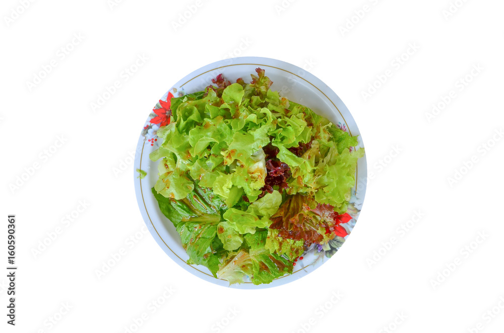 Salad vegetables in a dish on a red wooden floor. Salad vegetables in a dish on a red wooden floor.