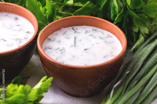 Ayran with fresh herbs. Traditional Turkish yoghurt drink.