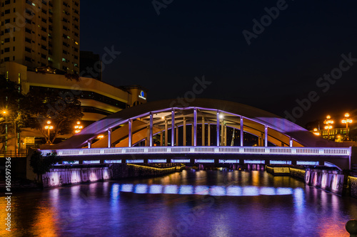 Singapore Elgin Bridge and tourist boats at night with lighting photo