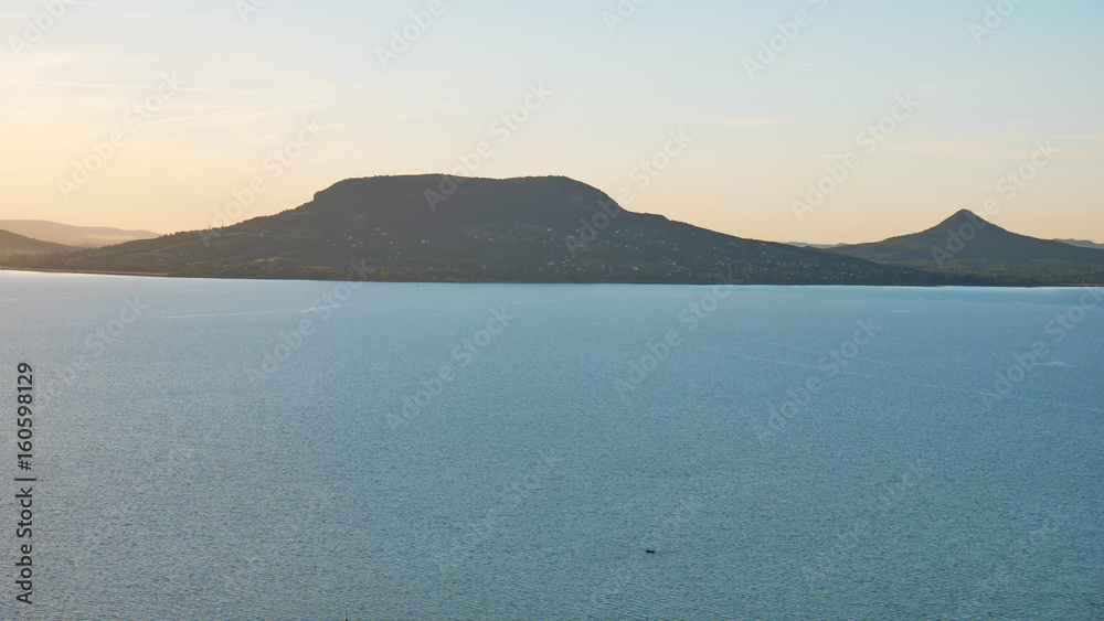 One of Europe's largest lakes - Balaton. Popular tourist tours from many continental countries. Shallow fast warming lake.