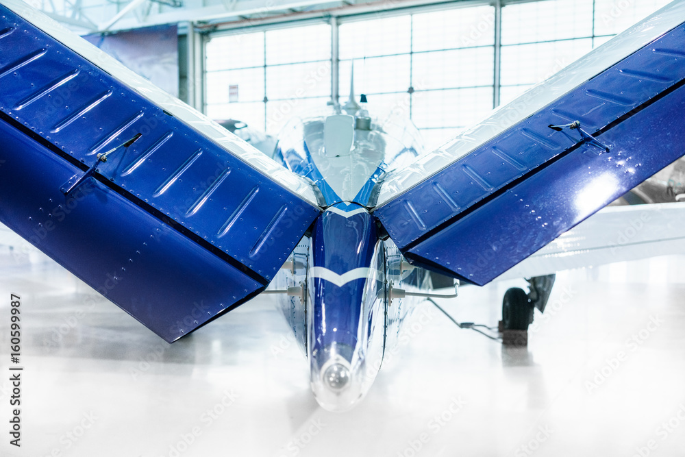 Rear end of restored stationary propeller plane, indoors, at day. foto ...