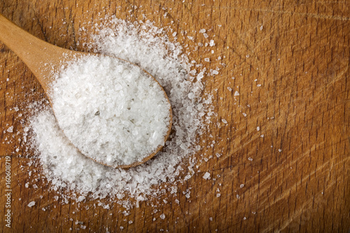 Coarse grained sea salt in spoon photo