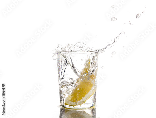 Lemon falls in a glass of water - Splash