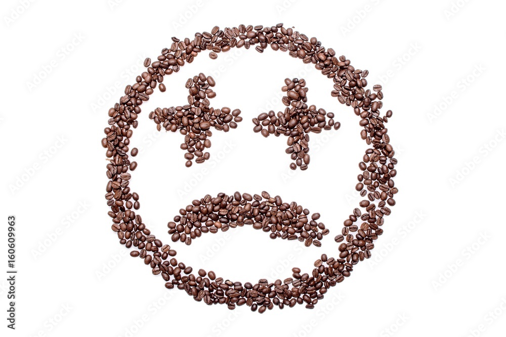 Sad smiley from coffee beans, isolated on white background Sad smiley from coffee beans, isolated on white background