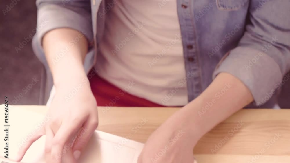Close up view of businesswoman quickly typing on laptop. On toned footage close up view of keyboarding hands and woman`s face.