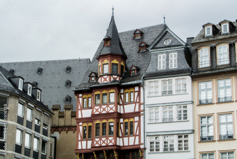 FRANKFURT, GERMANY - JUNE 4, 2017: Traditional german decorated houses at the Frankfurt Old town square on cloudy rainy summer day.
