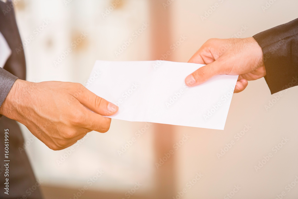 Businessmen receiving envelope return on a office. Businessmen receiving envelope return on a office.