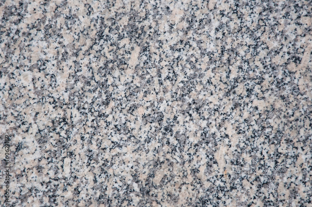 A marble background with small spots of black and white colors A marble background with small spots of black and white colors