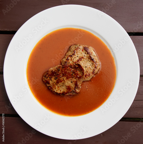 Fried pork with thick sauce in plate