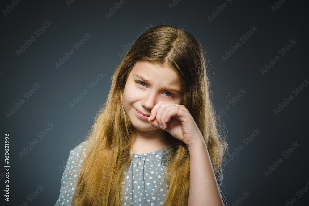 offense crying girl isolated on gray background