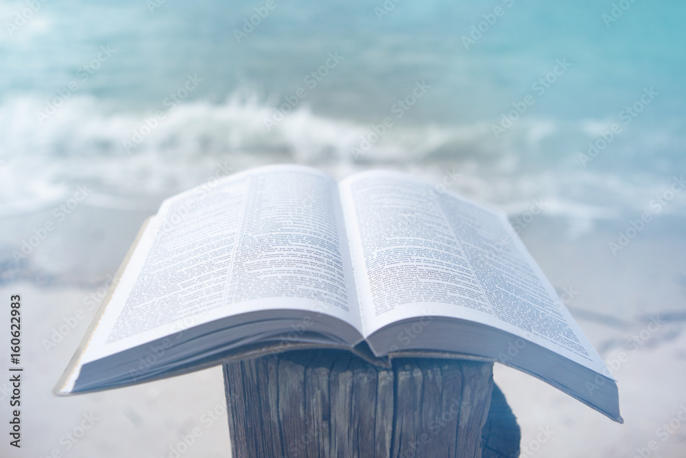 Fototapeta premium Bible on the Beach with Copy Space