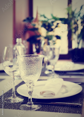 Fotografie Place setting in an expensive restaurant, toned