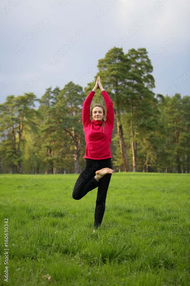 Yoga woman exercise in park, outdoor, forest, natural background Yoga woman exercise in park, outdoor, forest, natural background