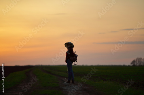 Woman standing in field amazing sunset nature