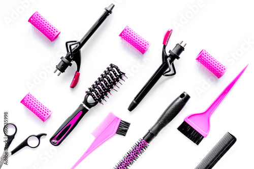 Hairdressing tools compositoin on white background top view