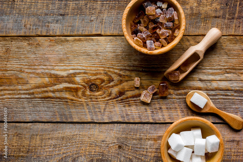 cooking sweets set with different sugar lumps on rustic table background top view mockup