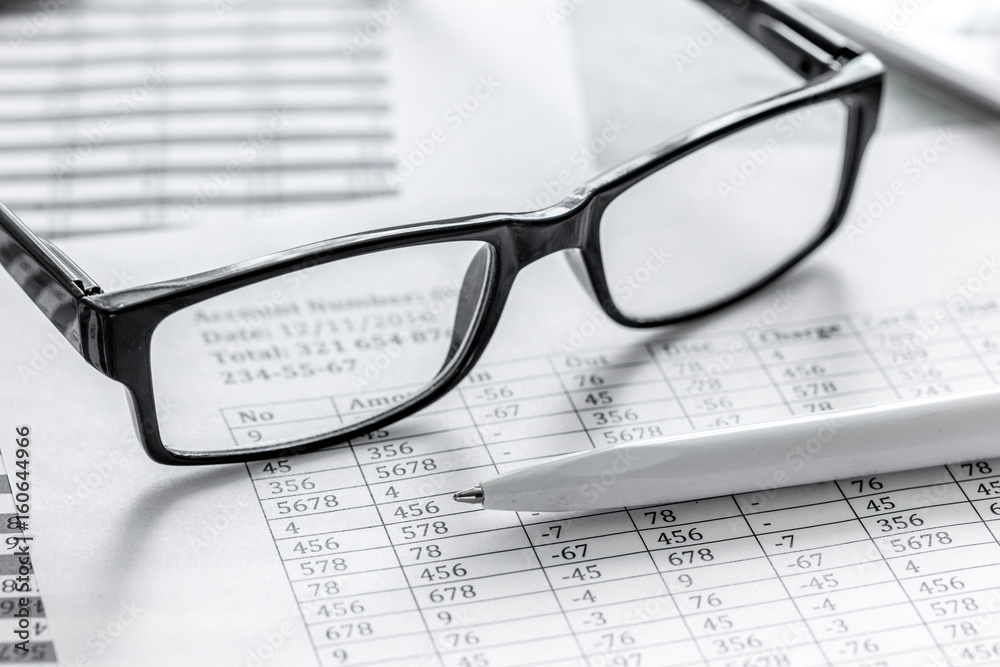 taxes accounting in office work space on stone desk background top view taxes accounting in office work space on stone desk background top view