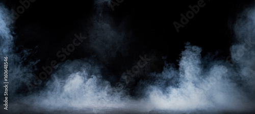 Image of dense fume swirling in the dark interior photo