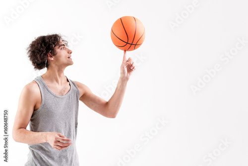 Cheerful skinny male basketball player