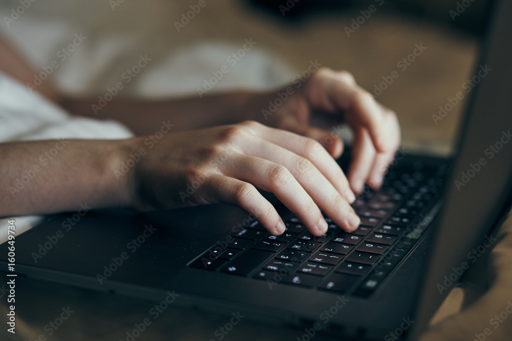 Business woman is typing on a keyboard, closeup of a business woman hands on a laptop keyboard Business woman is typing on a keyboard, closeup of a business woman hands on a laptop keyboard
