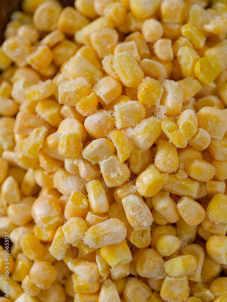 frozen sweet corn on woode surface frozen sweet corn on woode surface