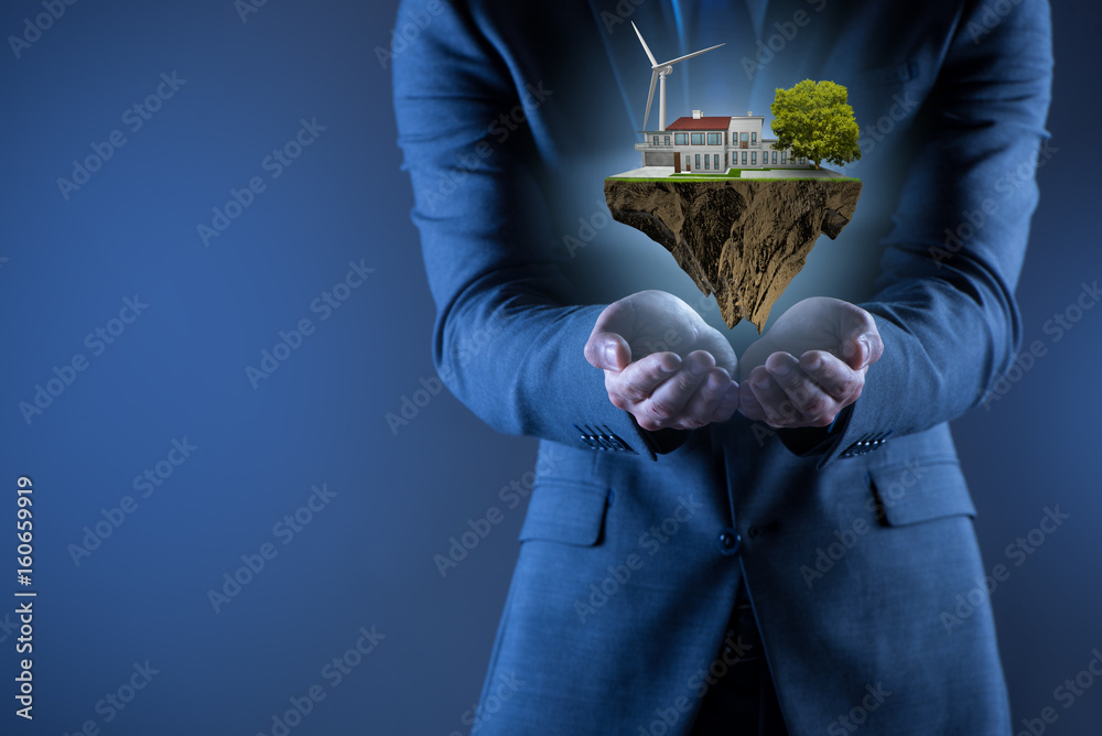 Businessman holding flying island in eco concept