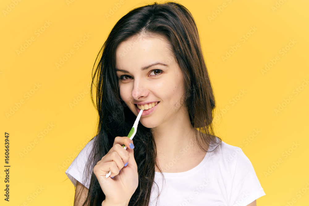 Woman brushing her teeth after breakfast studio Woman brushing her teeth after breakfast studio