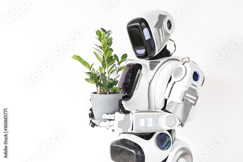 Modern cyborg is growing houseplant
