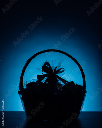 gift basket silhouette on blue background © nikkytok